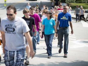 Protesters walking in Fort Sanders. Activism and Economics