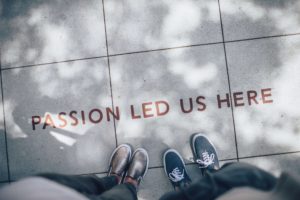 Passion led us here written on sidewalk. Everyday heroes of activism. Learn from activists.
