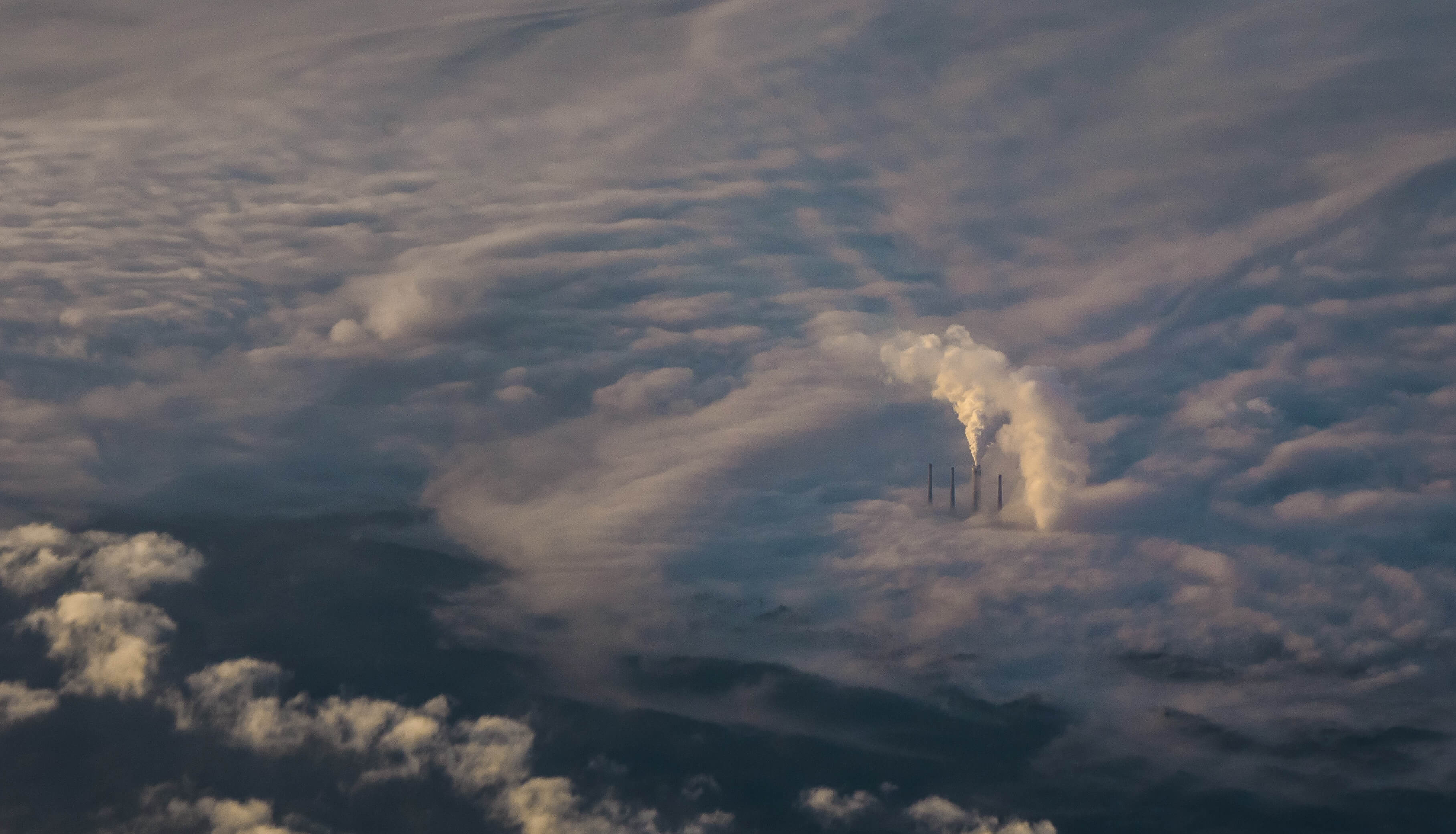 Overhead view of plant spewing pollution, environmental injustice