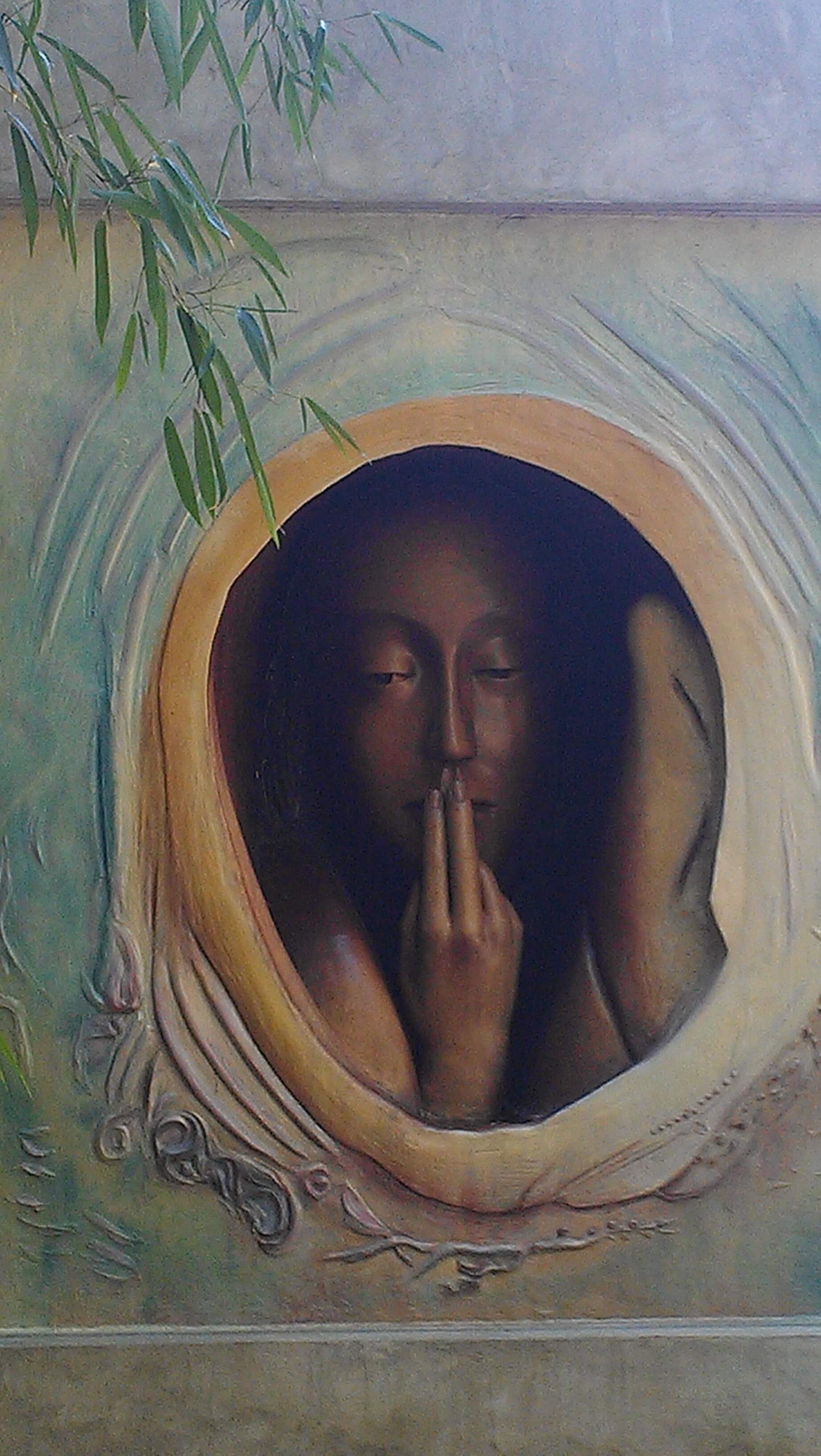 Sculpture of woman with fingers on lips. Sensitivity readers.