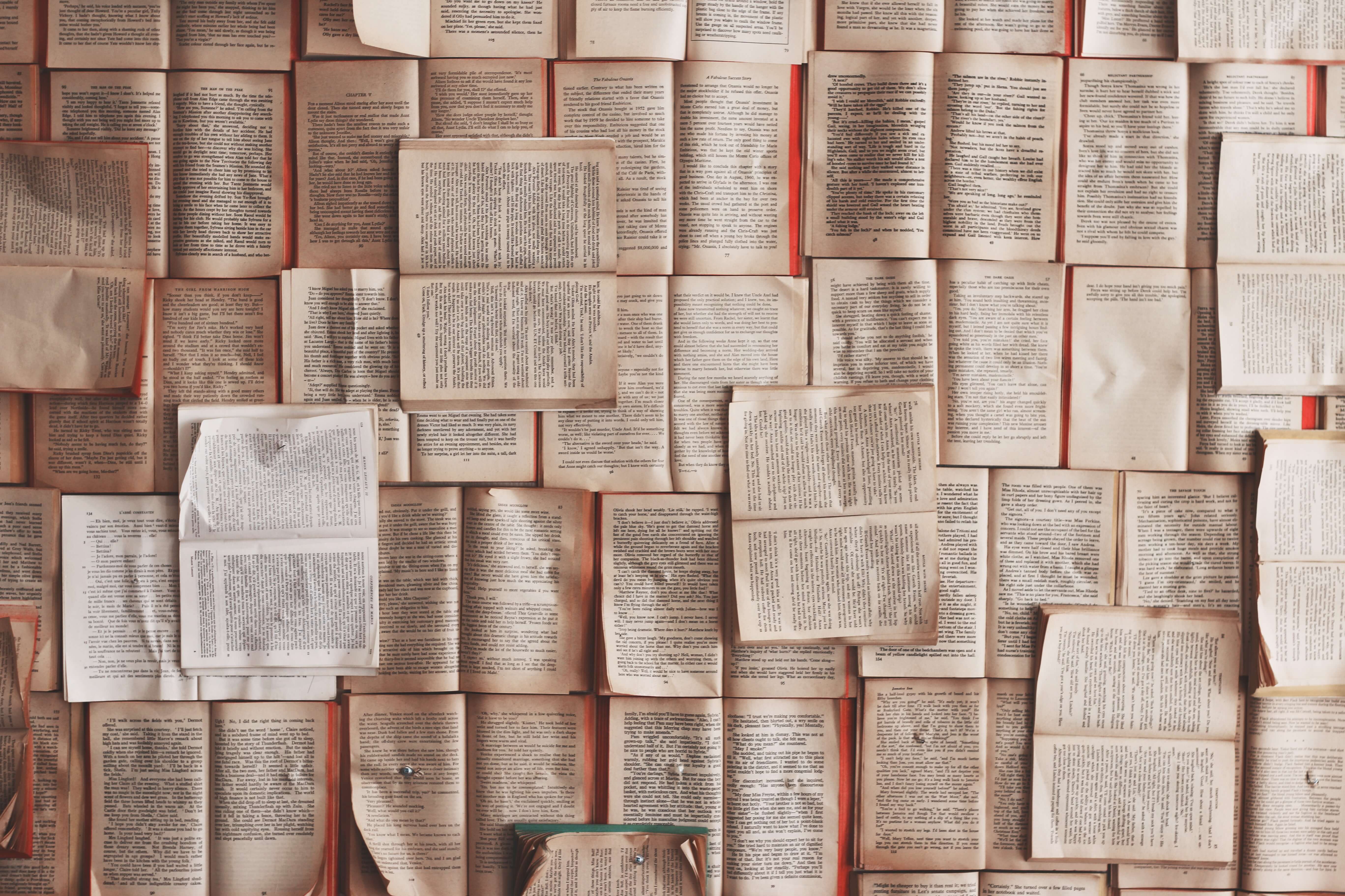 A pile of open books. Sensitivity Readers.