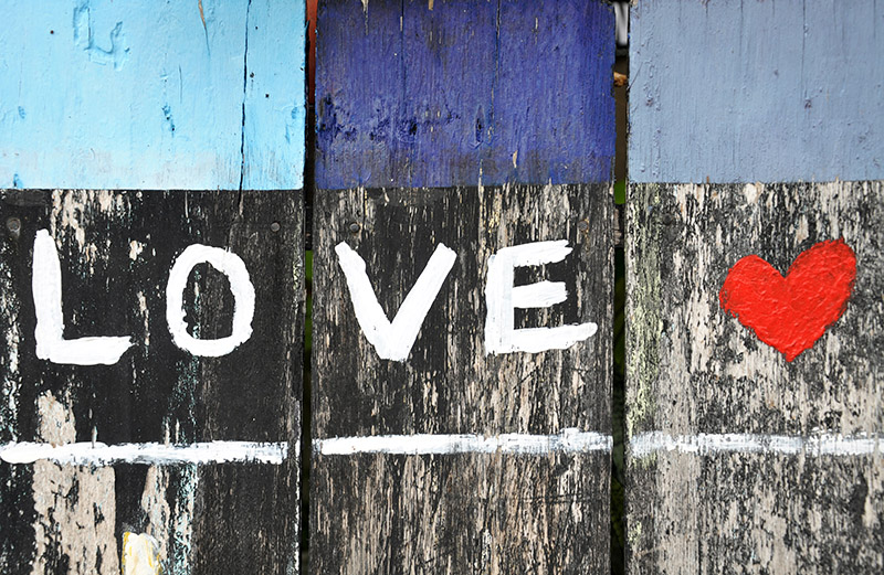 Love painted on fence