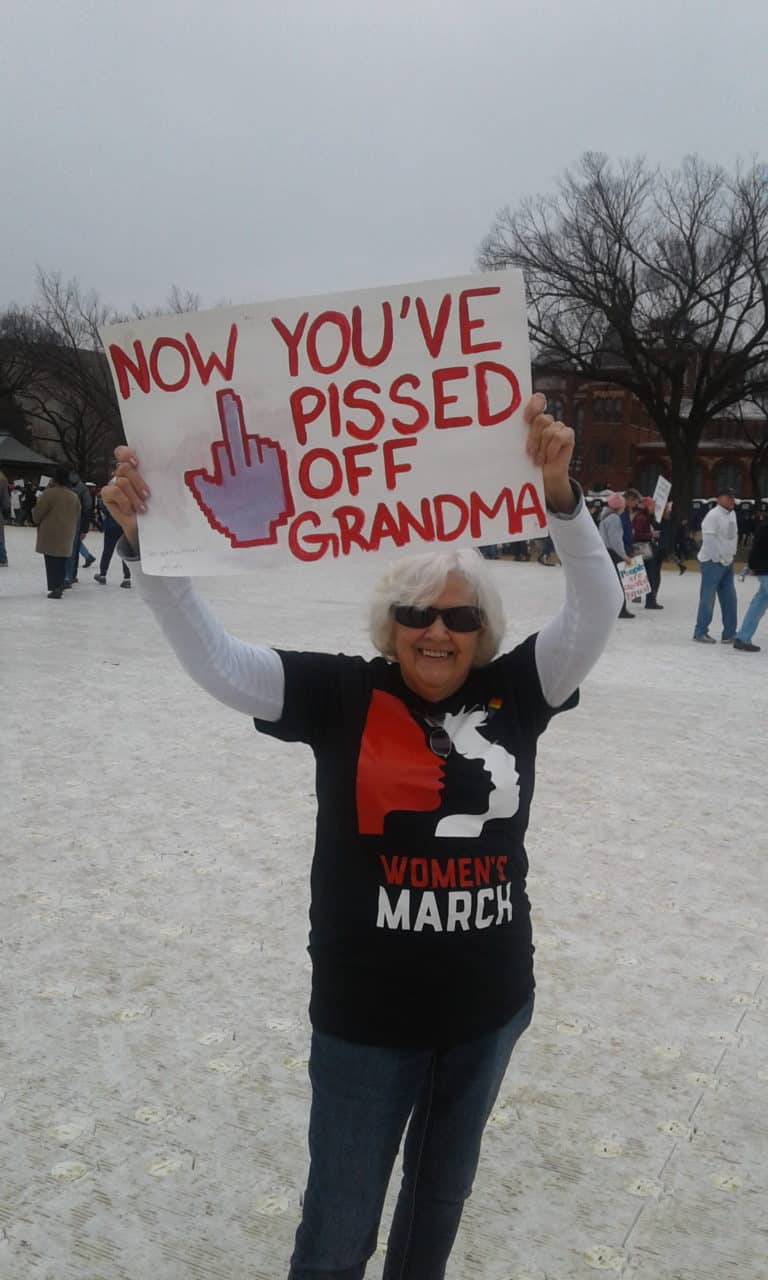 Grandma holding protest sign
