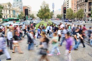 people moving through a crosswalk
