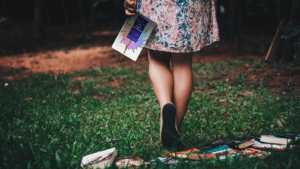 woman holding What's on Your Sign book