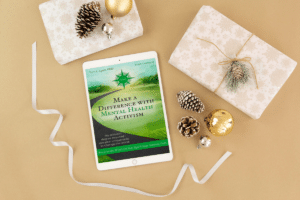 Desktop with mental health ebook and decorations activist gifts