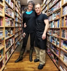 Terri and a friend standing the aisles at Southland Books