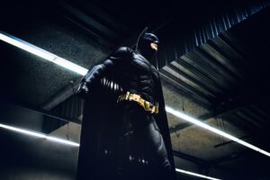 Batman in a dark building.