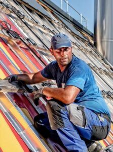 A construction worker on a roof.