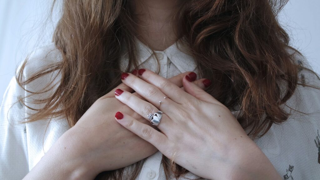 Woman with hands on heart. Cause closest to heart. Find your cause. Focus your passion.