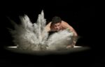A white man slapping a pan of white powder, personal power and privilege.