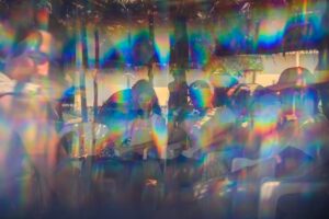 A shimmery kaleidoscope of people in rainbow colors to represent Terri Lyon's Life At The Intersection.