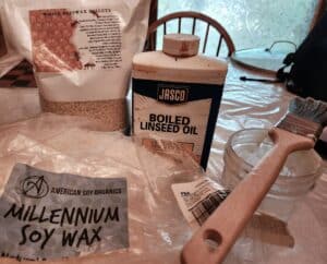 Soy wax, beeswax, boiled linseed oil, a glass jar and a paint brush to rewax your harvest bag..