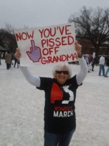 Grandma holding protest sign